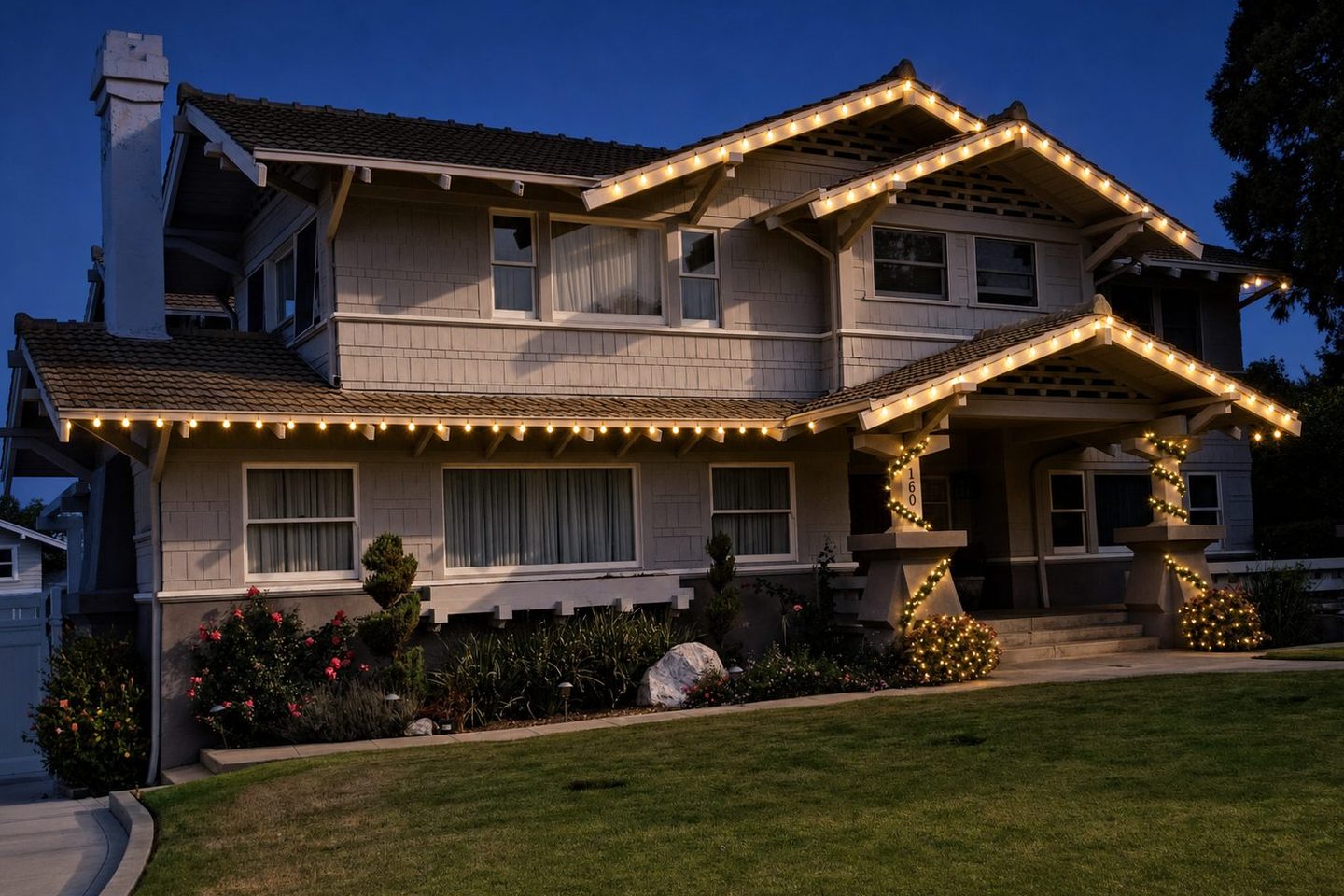 The same home rendered by Foreman with a professional warm-white Christmas lighting installation at twilight